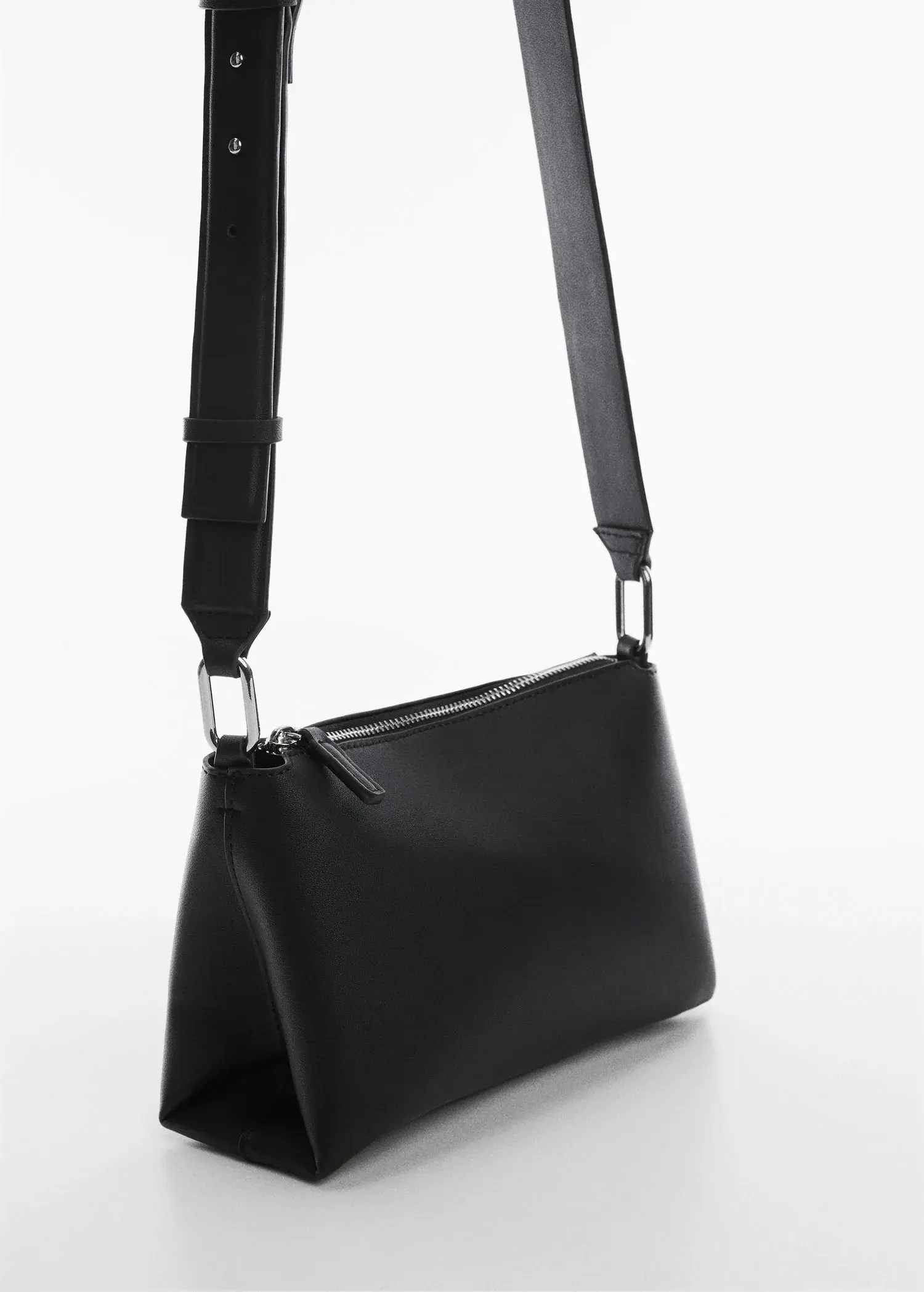 Mango Leather-effect shoulder bag. a close up of a black purse on a white surface 