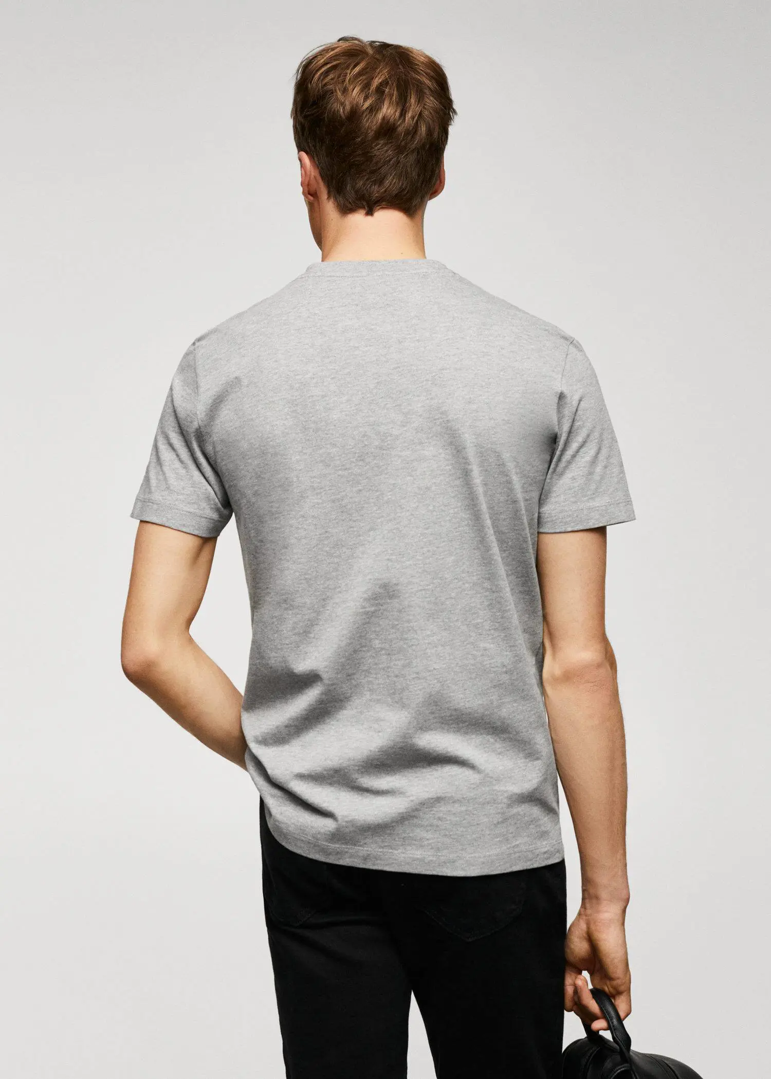 Mango Basic cotton V-neck T-shirt. a man is wearing a gray t-shirt 
