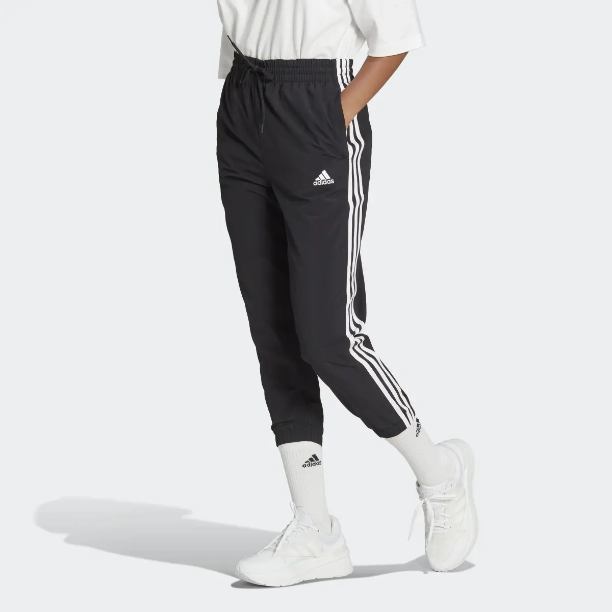 Adidas Essentials 3-Stripes Woven 7/8 Pants. 1