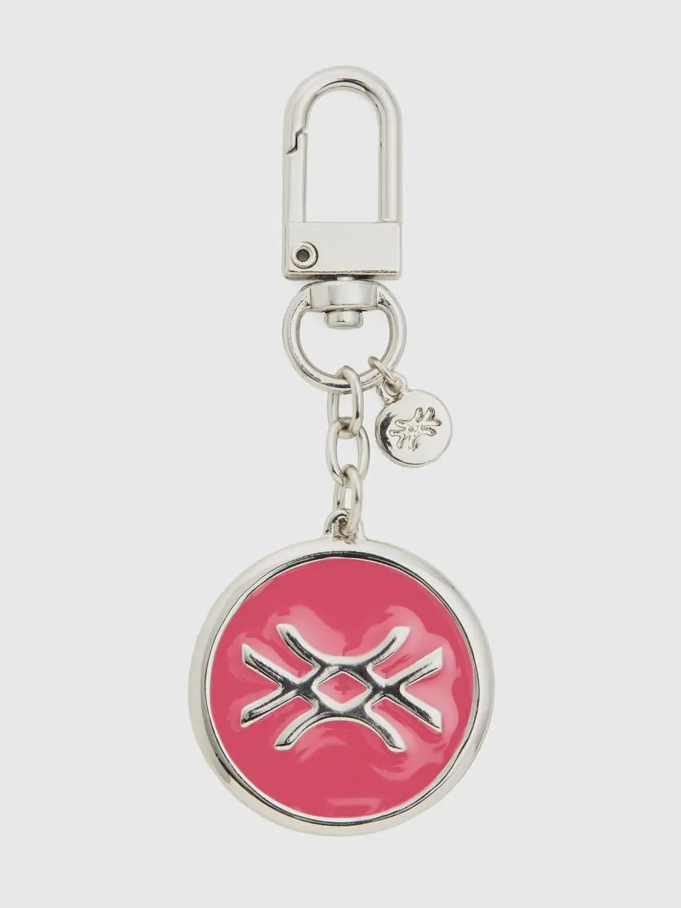Benetton silver keychain with pink pendant. 1