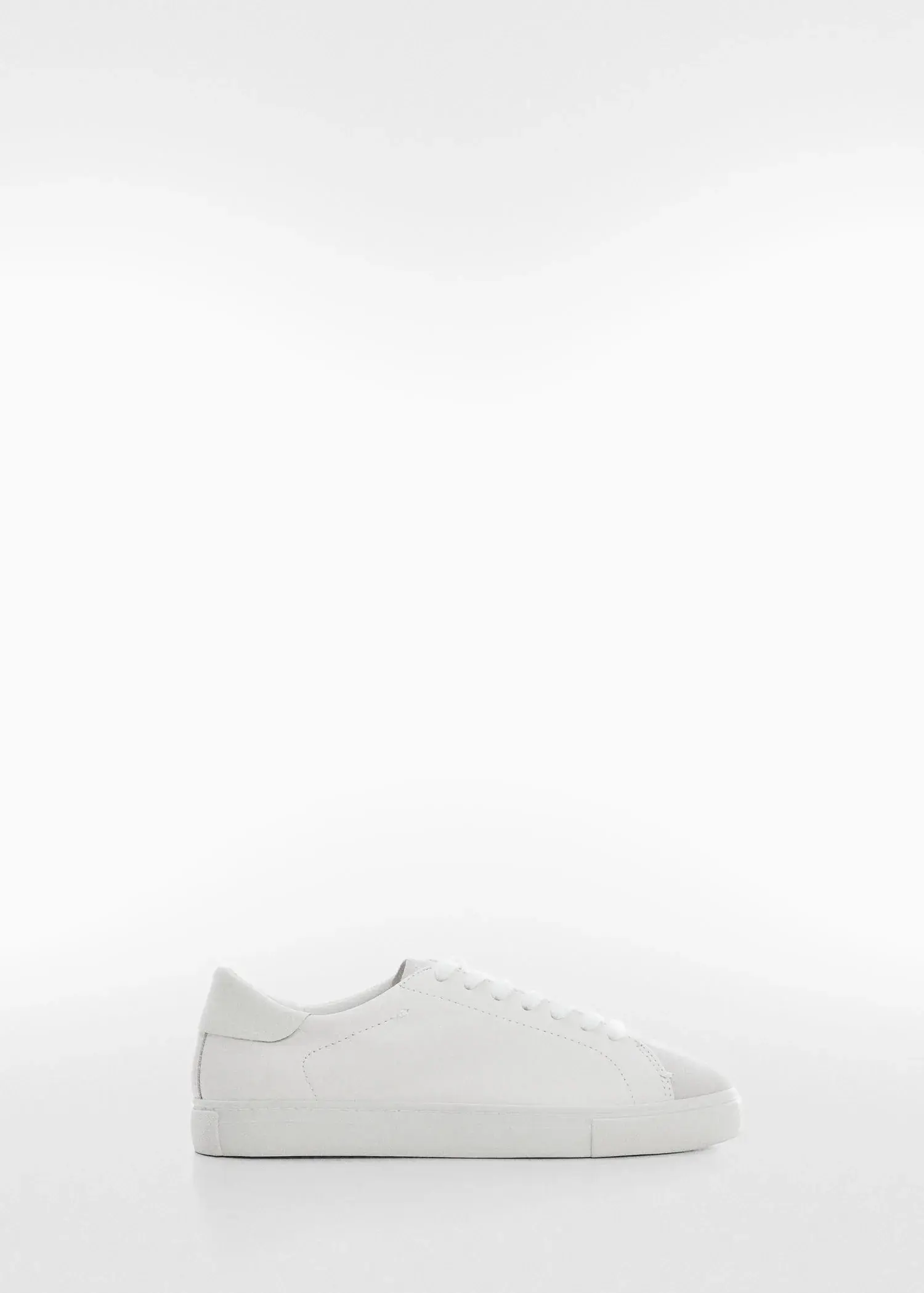 Mango Leather panel sneakers. a pair of white shoes on a white background. 