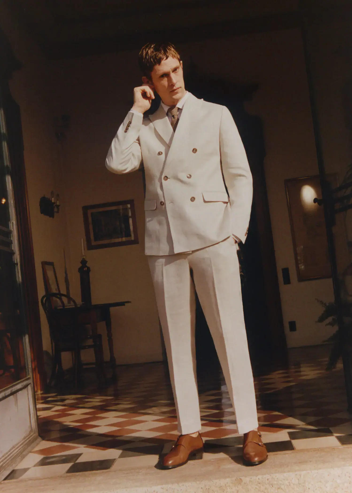 Mango 100% linen suit trousers. a man in a white suit is talking on the phone. 