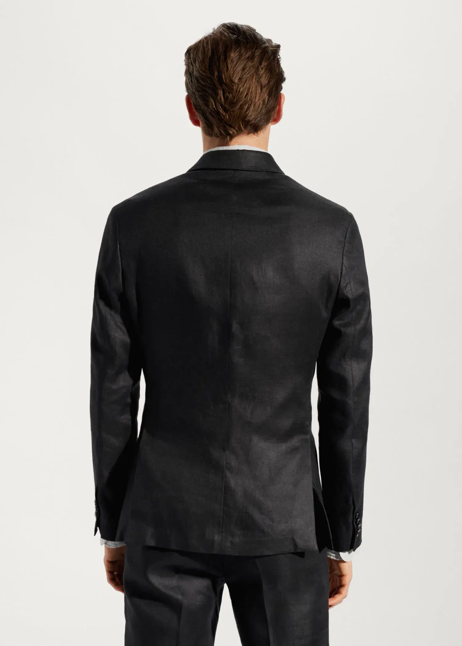 Mango Blazer suit 100% linen. a man wearing a black jacket and brown pants. 