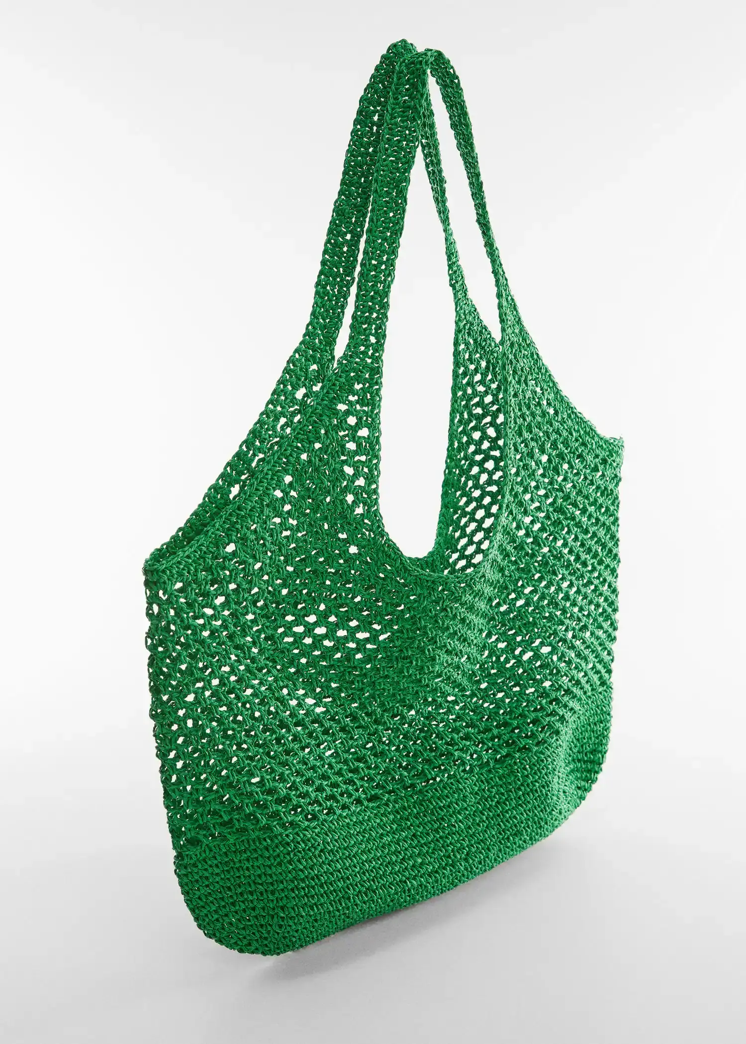Mango Natural fibre sack bag. a crocheted green bag on a white surface. 