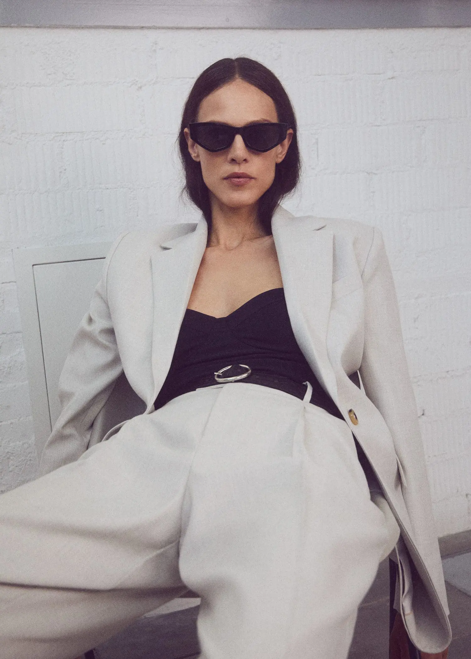 Mango Patterned suit blazer. a woman wearing a white suit and sunglasses. 