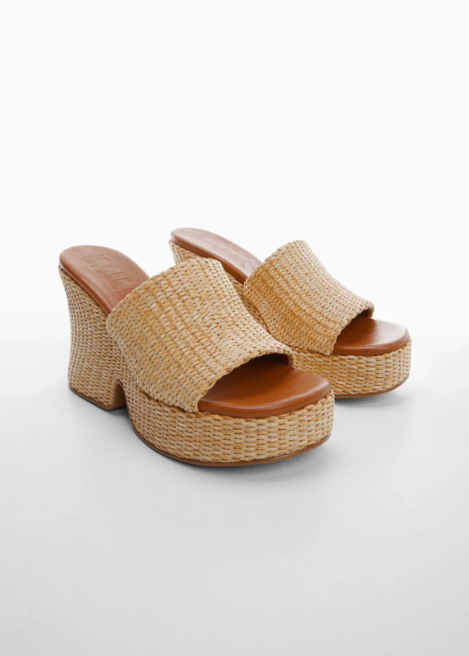 Mango Natural fiber wedge sandals. a close up of a pair of shoes on a white surface 