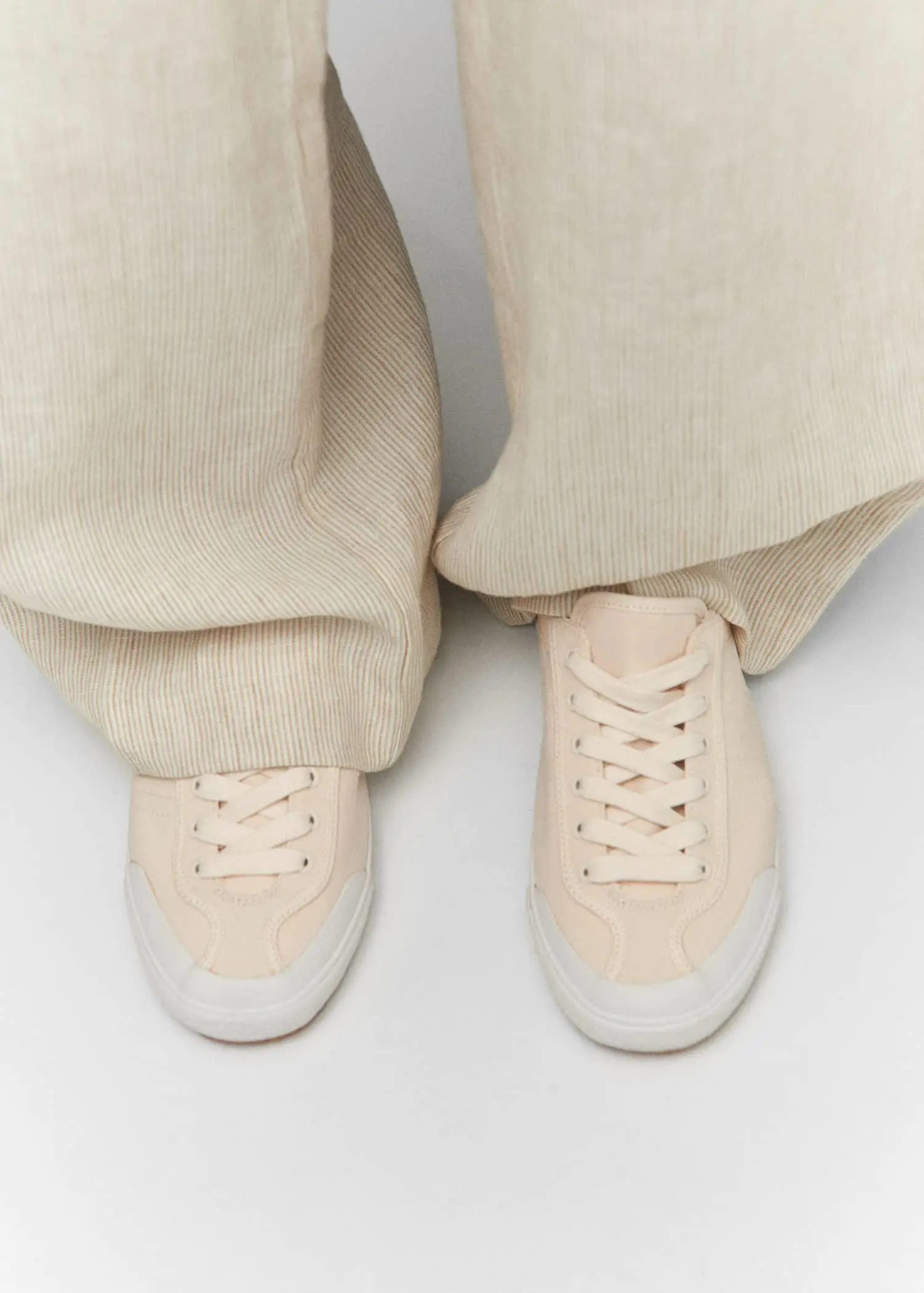 Mango Decorative seam sneakers. a pair of white shoes sitting next to each other. 