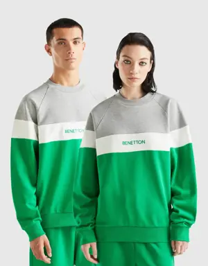 green and light gray sweatshirt