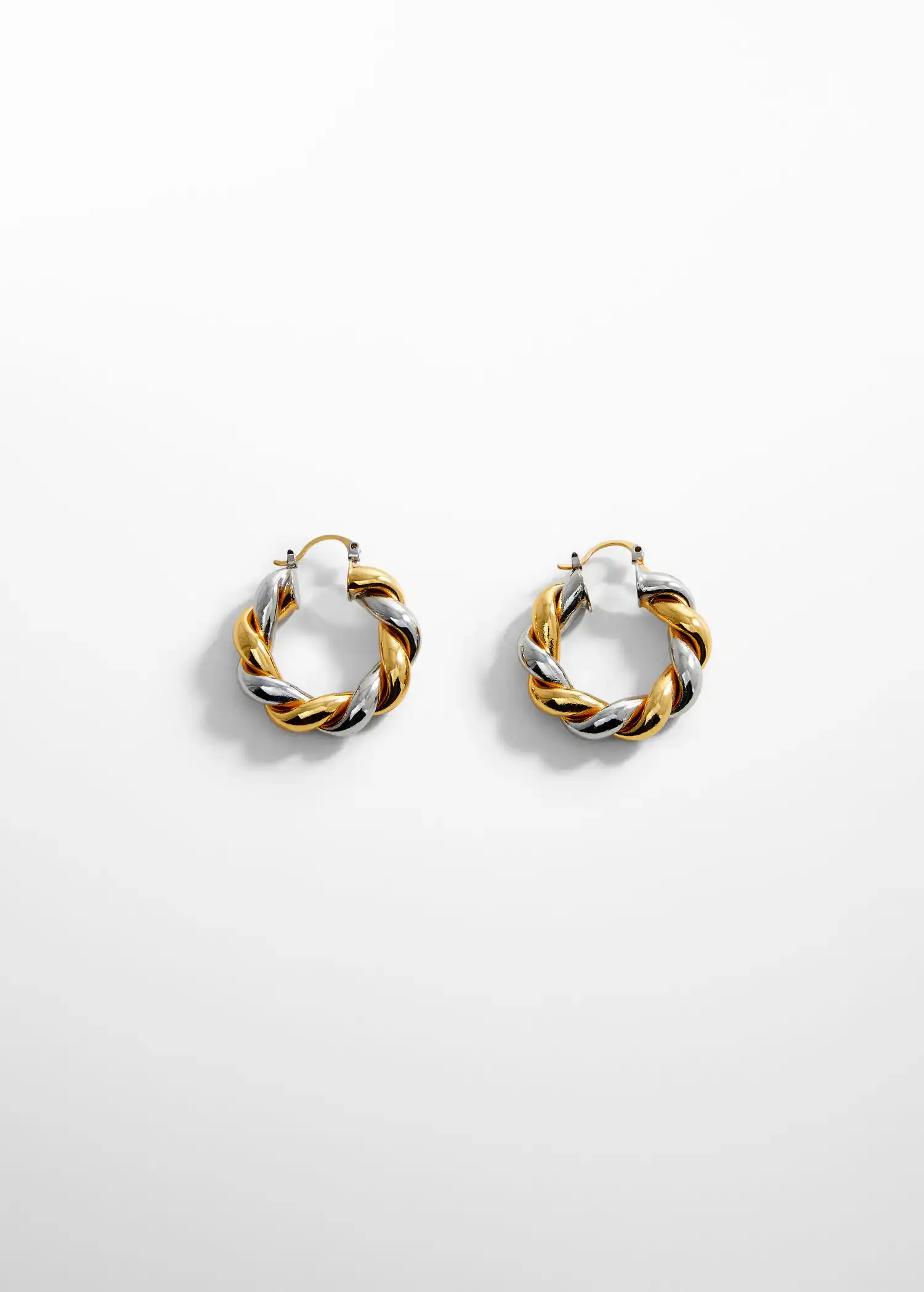 Mango Intertwined hoop earrings. a pair of gold and silver hoop earrings. 
