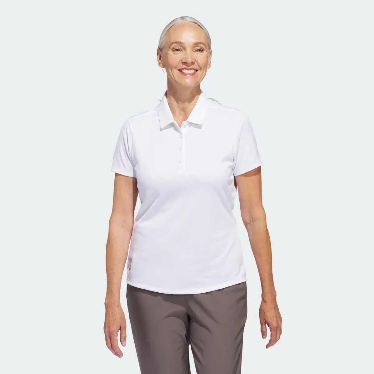 Adidas Women's Solid Performance Short Sleeve Polo Shirt. 2