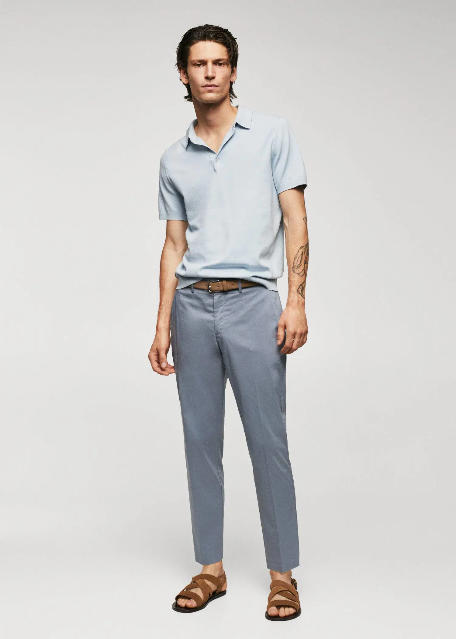 Mango Lightweight cotton trousers. a man in a light blue polo shirt and blue pants. 