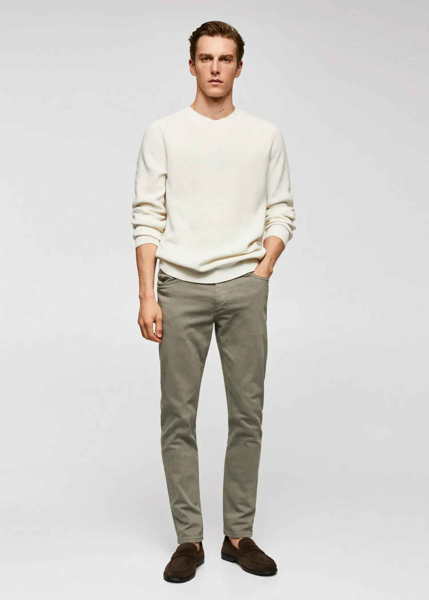 Mango Jan slim-fit jeans. a man in a white shirt and green pants. 