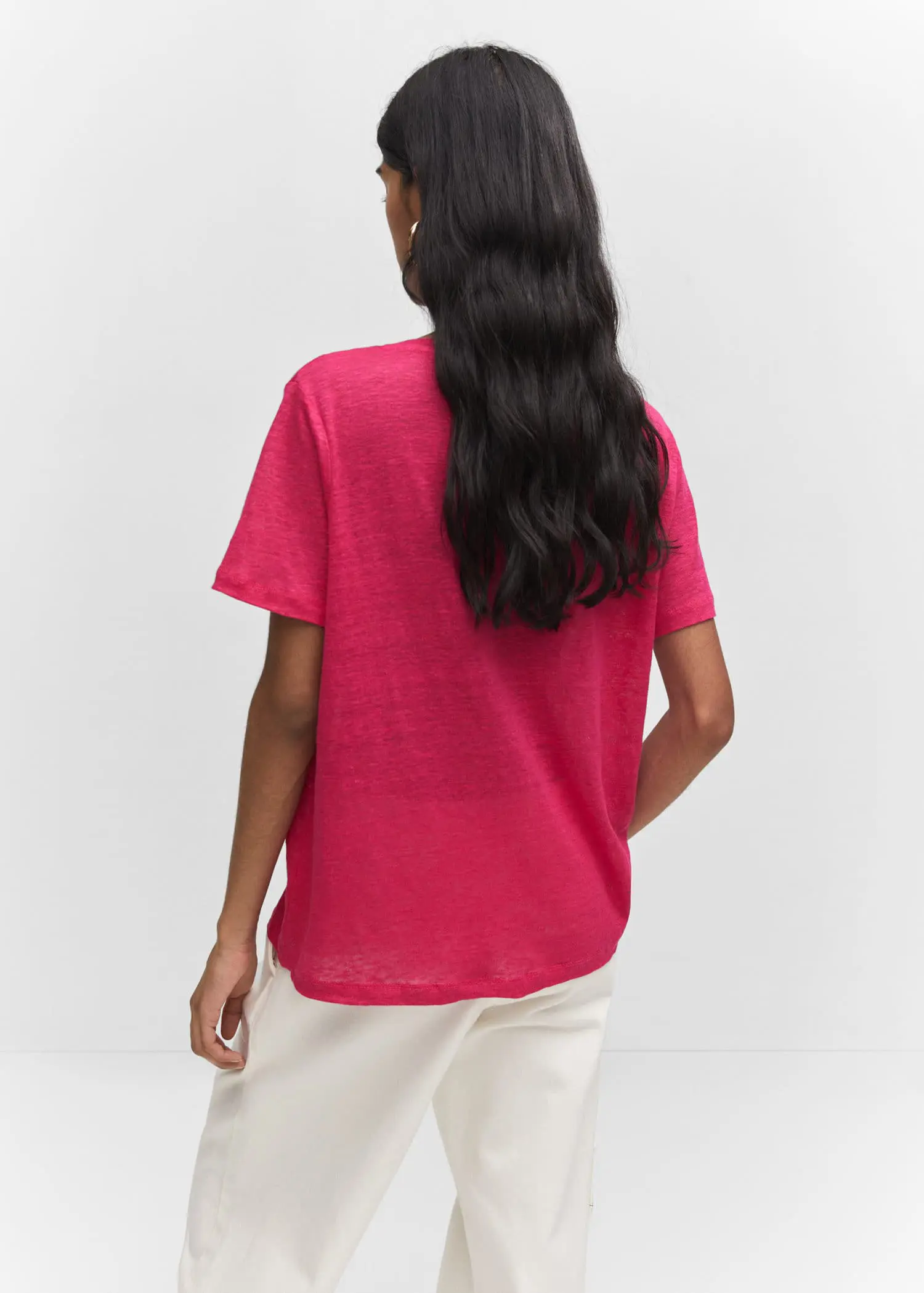 Mango V-neck linen t-shirt. a woman with long black hair is wearing a pink shirt. 