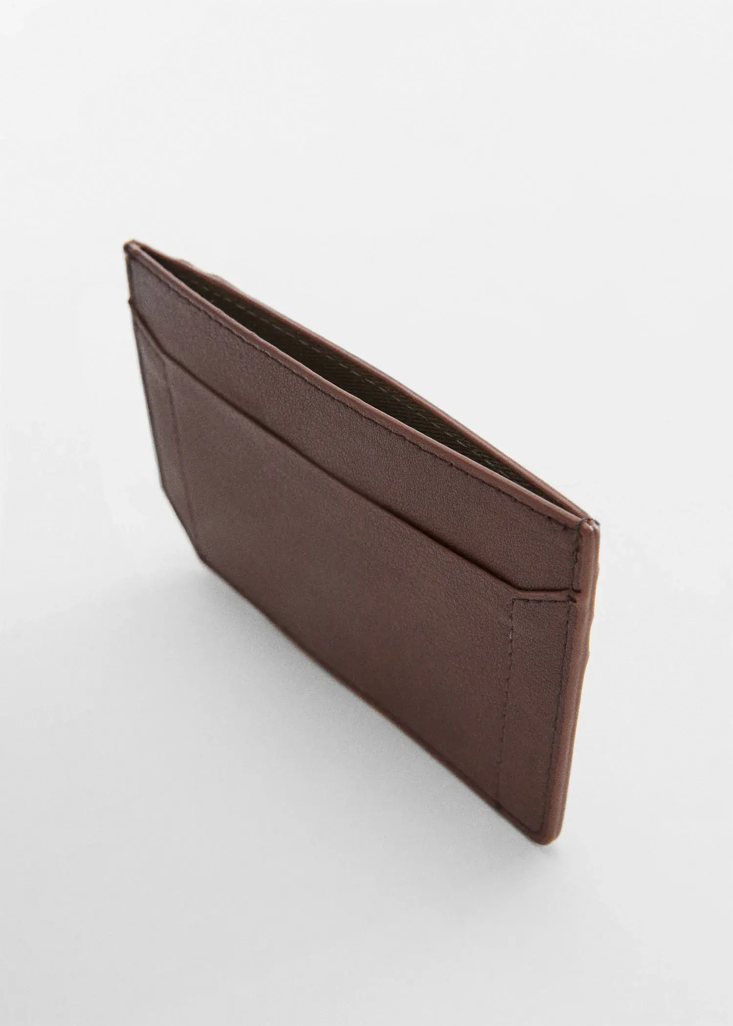 Mango Anti-contactless leather-effect card holder. a close up of a brown wallet on a white background 