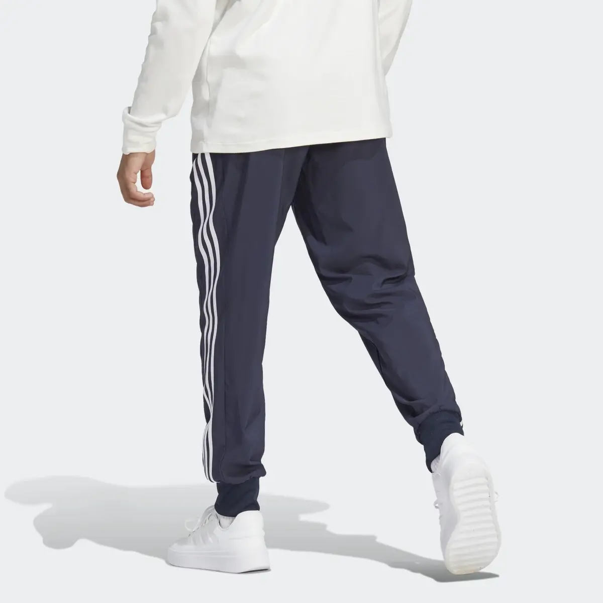 Adidas Pantalón AEROREADY Essentials Tapered Cuff Woven 3 bandas. 2