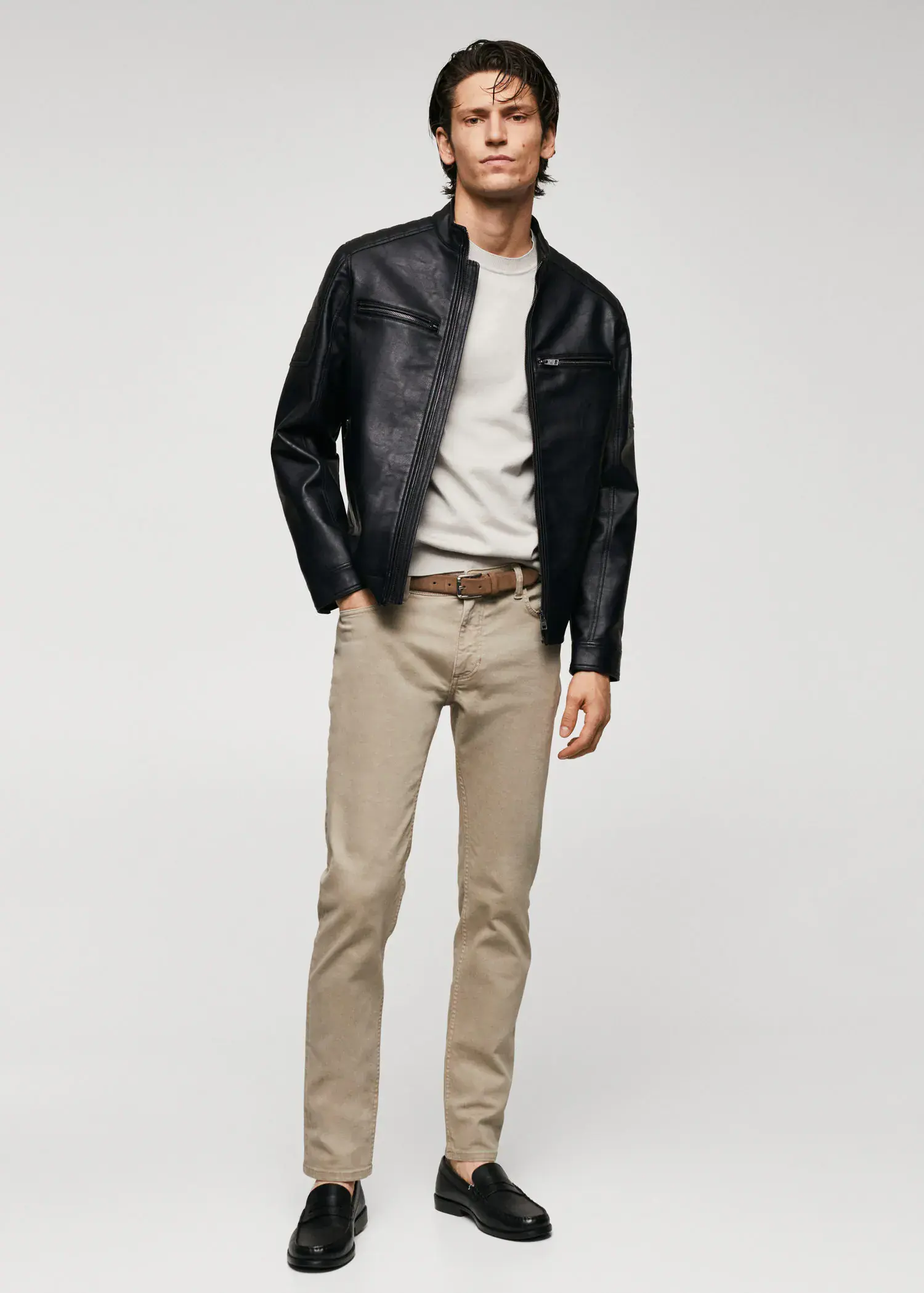Mango Nappa leather-effect jacket. a man wearing a black jacket and beige pants. 