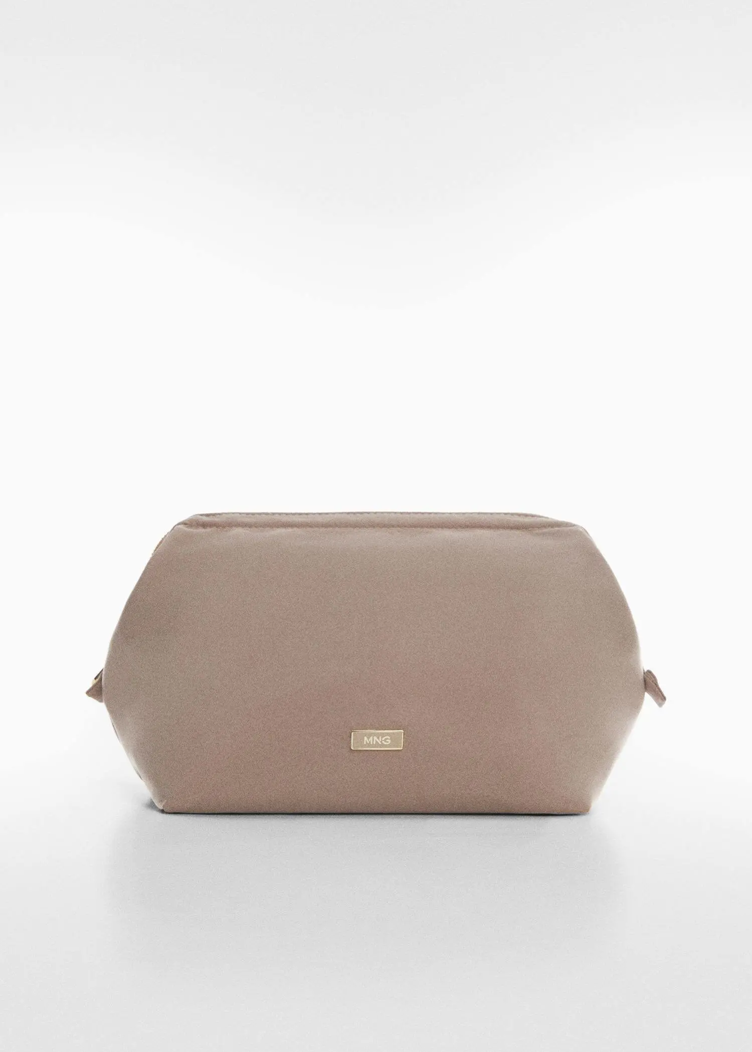 Mango Zipped nylon cosmetics bag. a beige purse sitting on top of a white table. 
