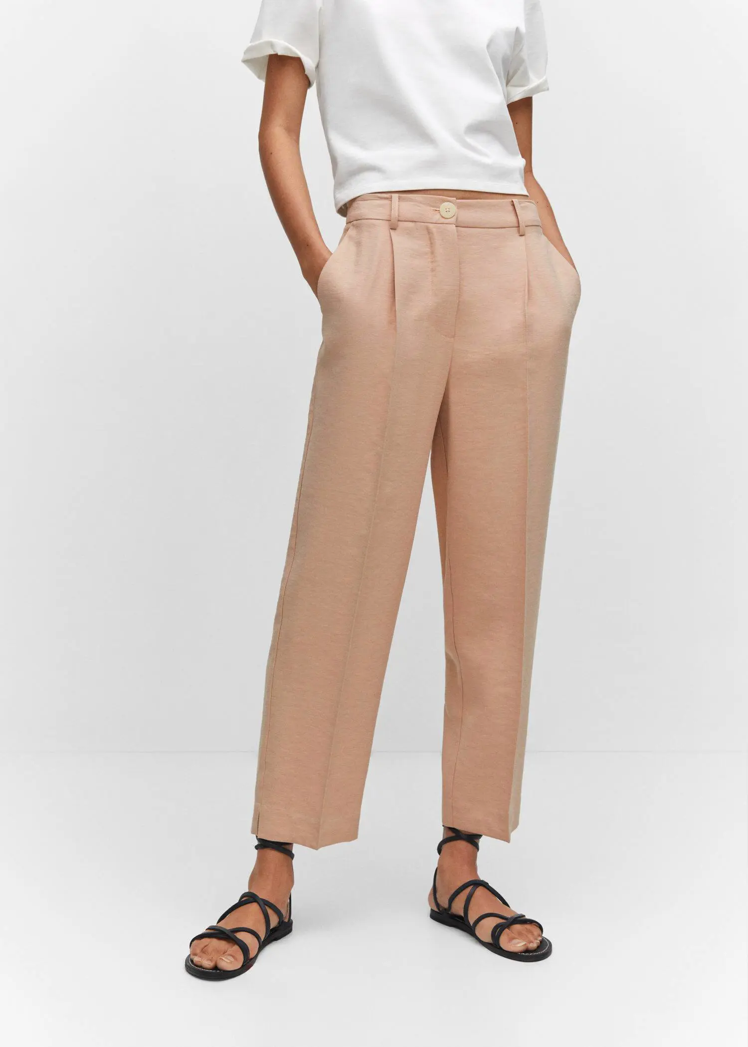 Mango Pleat straight trousers. a person wearing a pair of beige pants. 