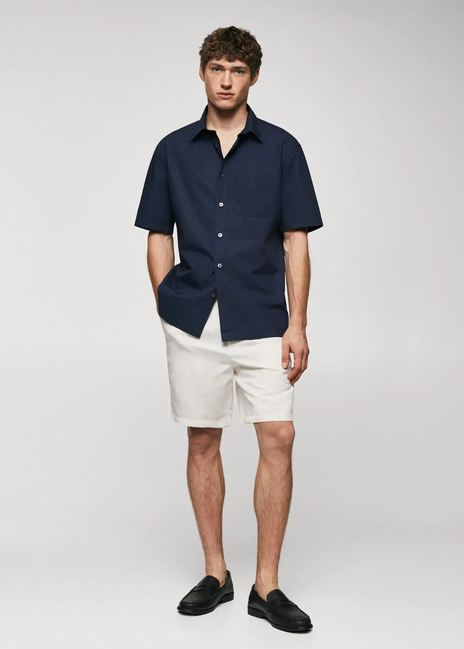 Mango Regular-fit cotton short sleeve shirt. a man in shorts and a button up shirt. 
