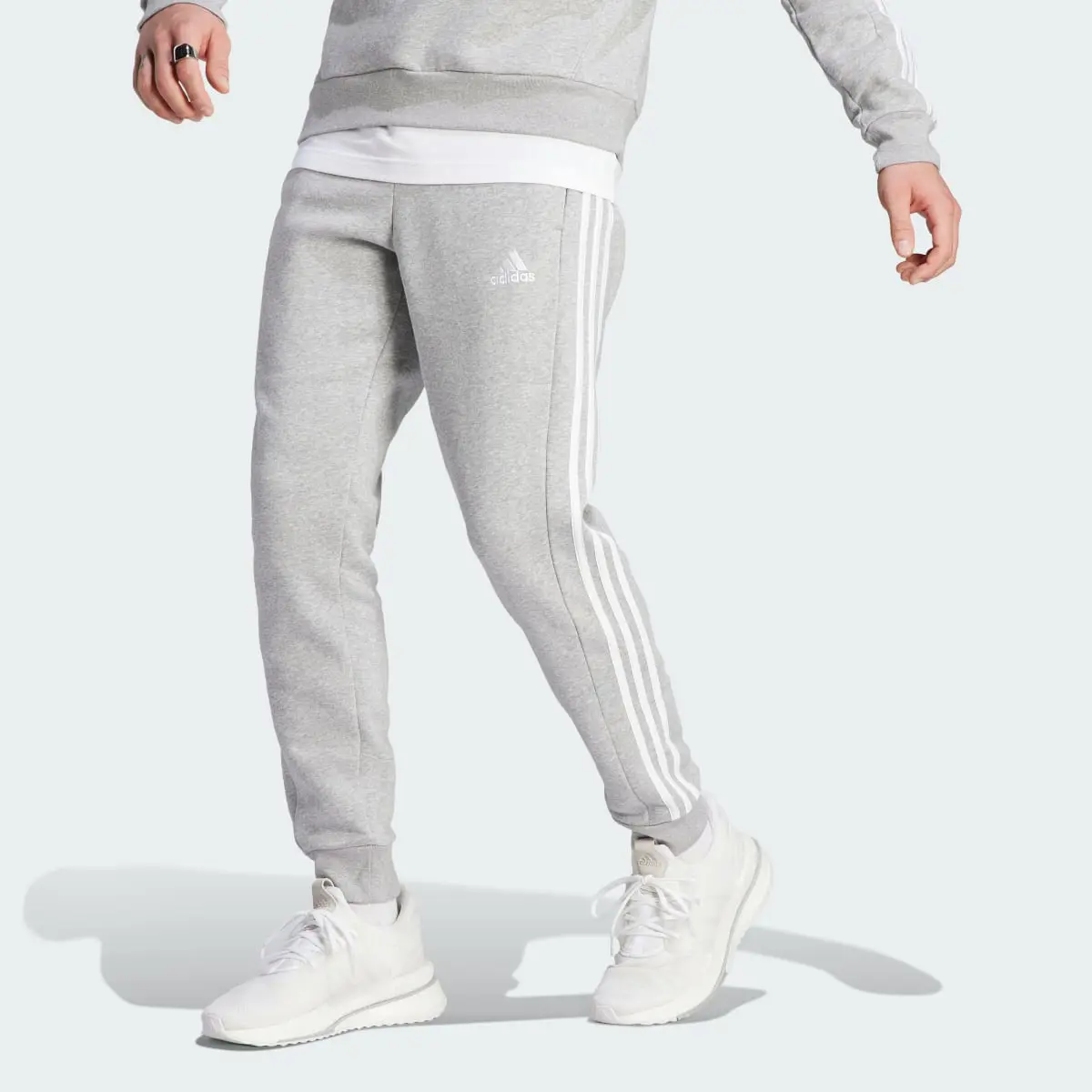 Adidas Essentials Fleece 3-Stripes Tapered Cuff Joggers. 1