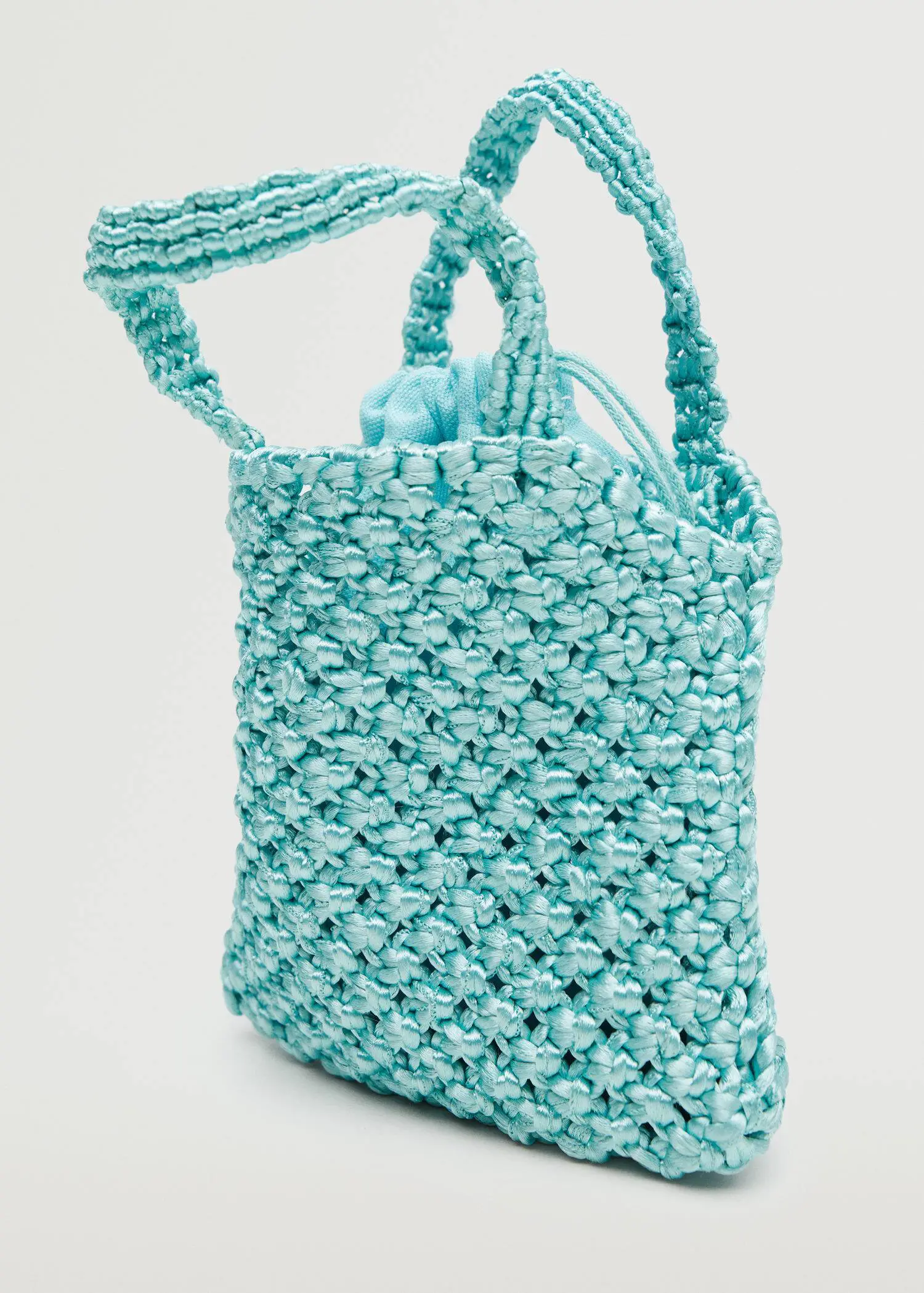 Mango Crochet mini bag. a close-up of a crocheted bag. 