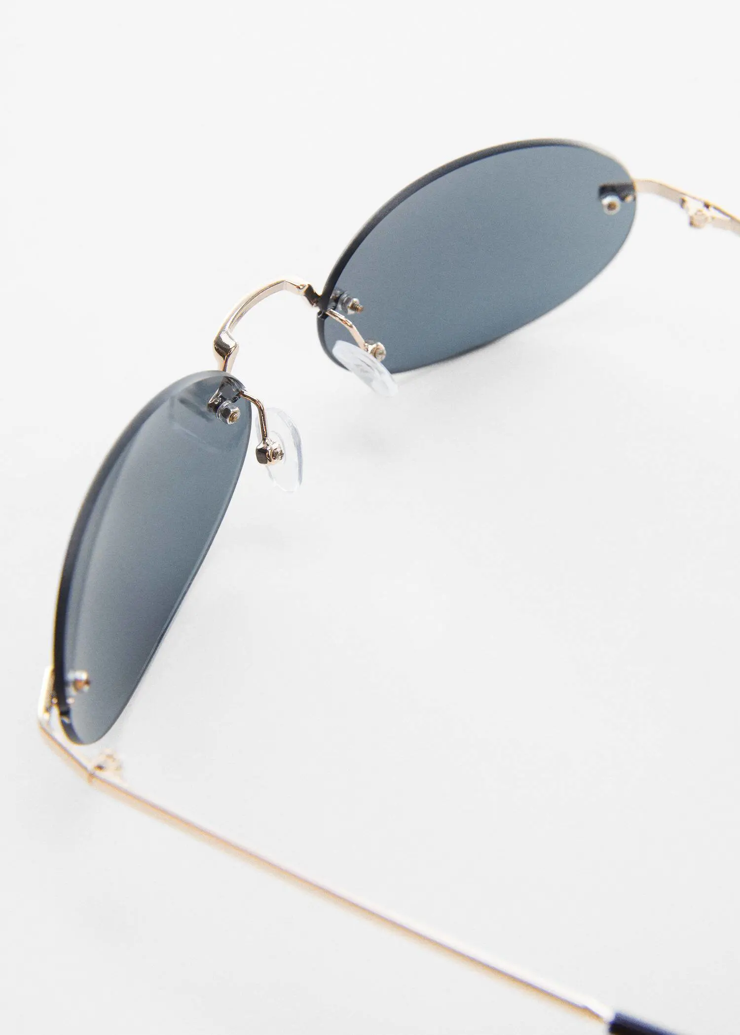 Mango Oval sunglasses. a close up of a pair of sunglasses on a table 