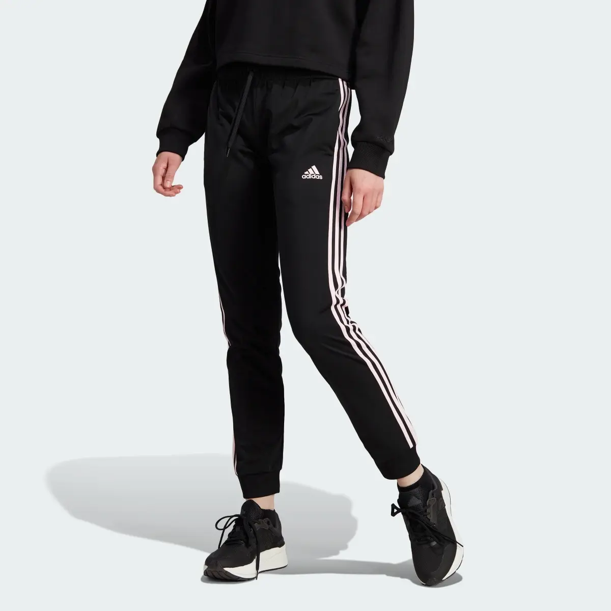 Adidas Primegreen Essentials Warm-Up Slim Tapered 3-Stripes Track Pants. 1