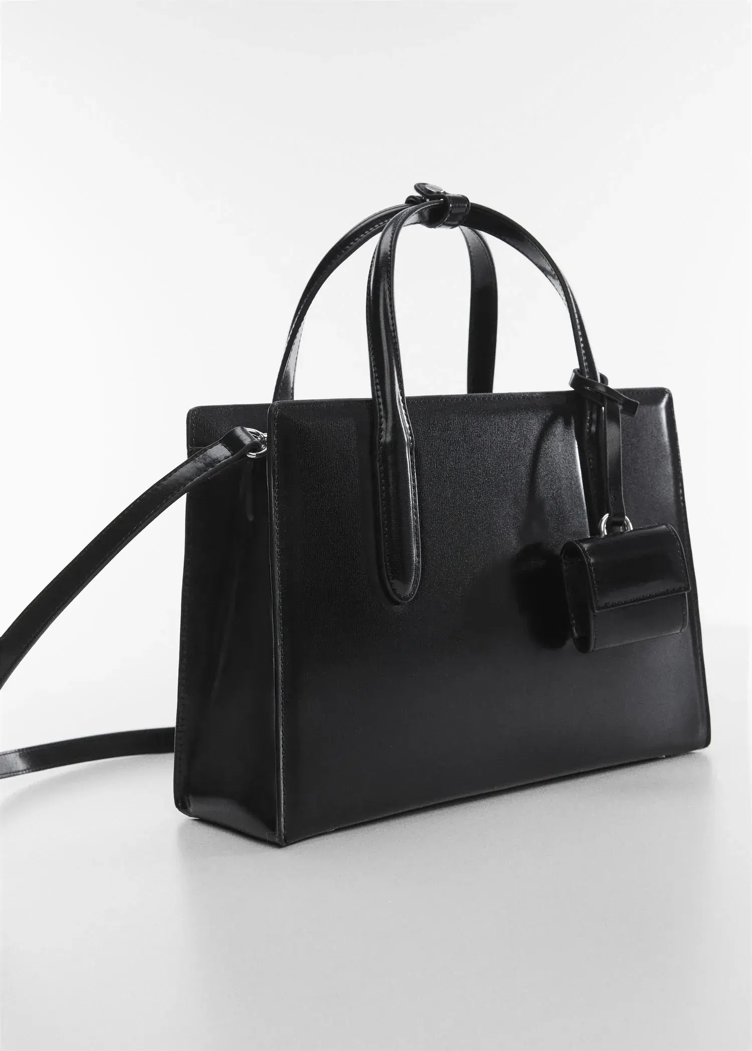 Mango Saffiano-effect shopper bag. a close up of a black purse on a table. 