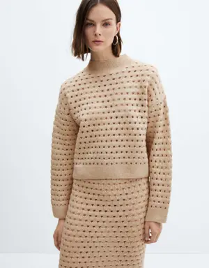Knitted sweater with openwork details