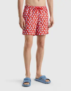red swim trunks with pear pattern