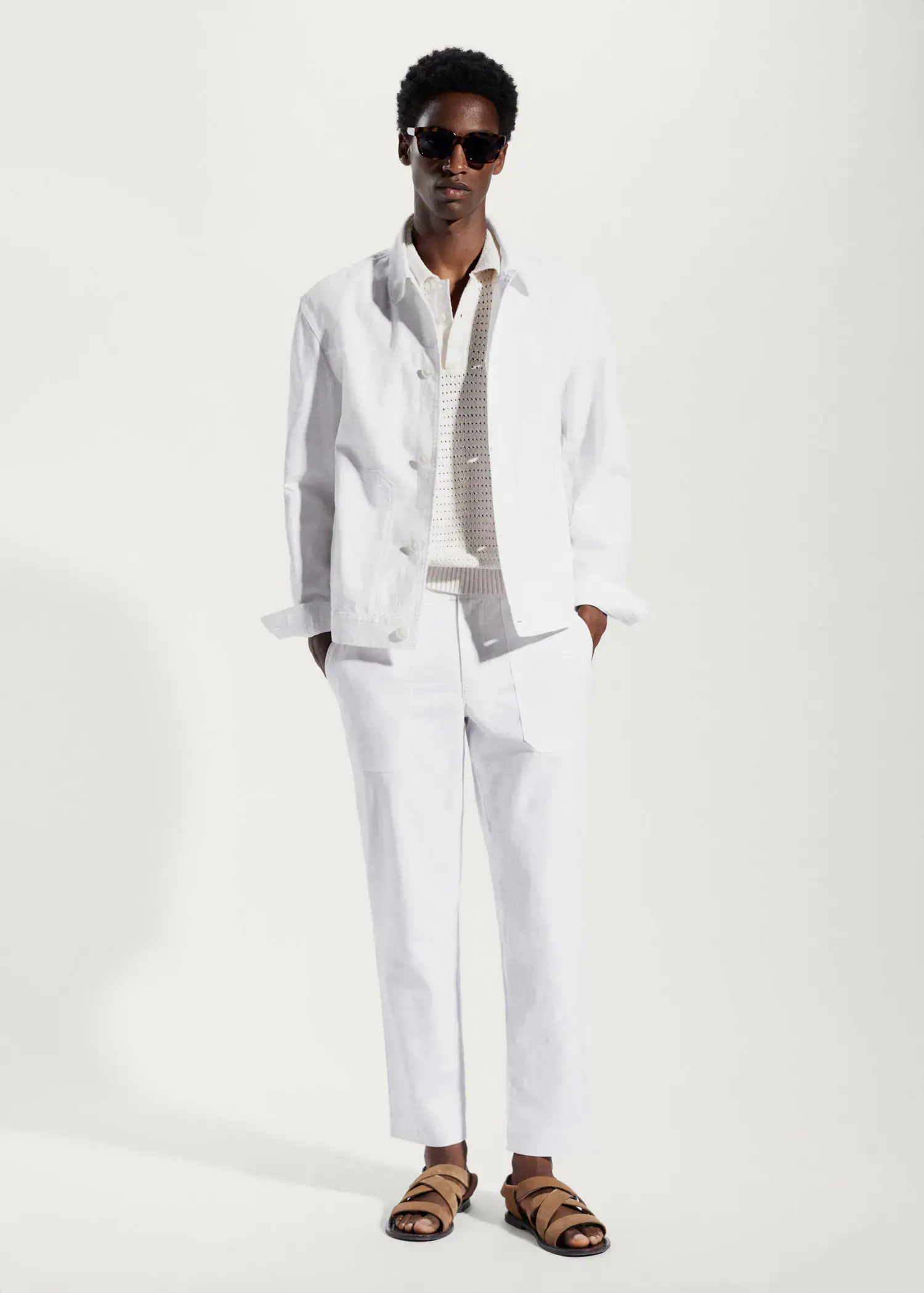 Mango Regular fit cotton linen trousers. a man wearing a white suit and tie. 