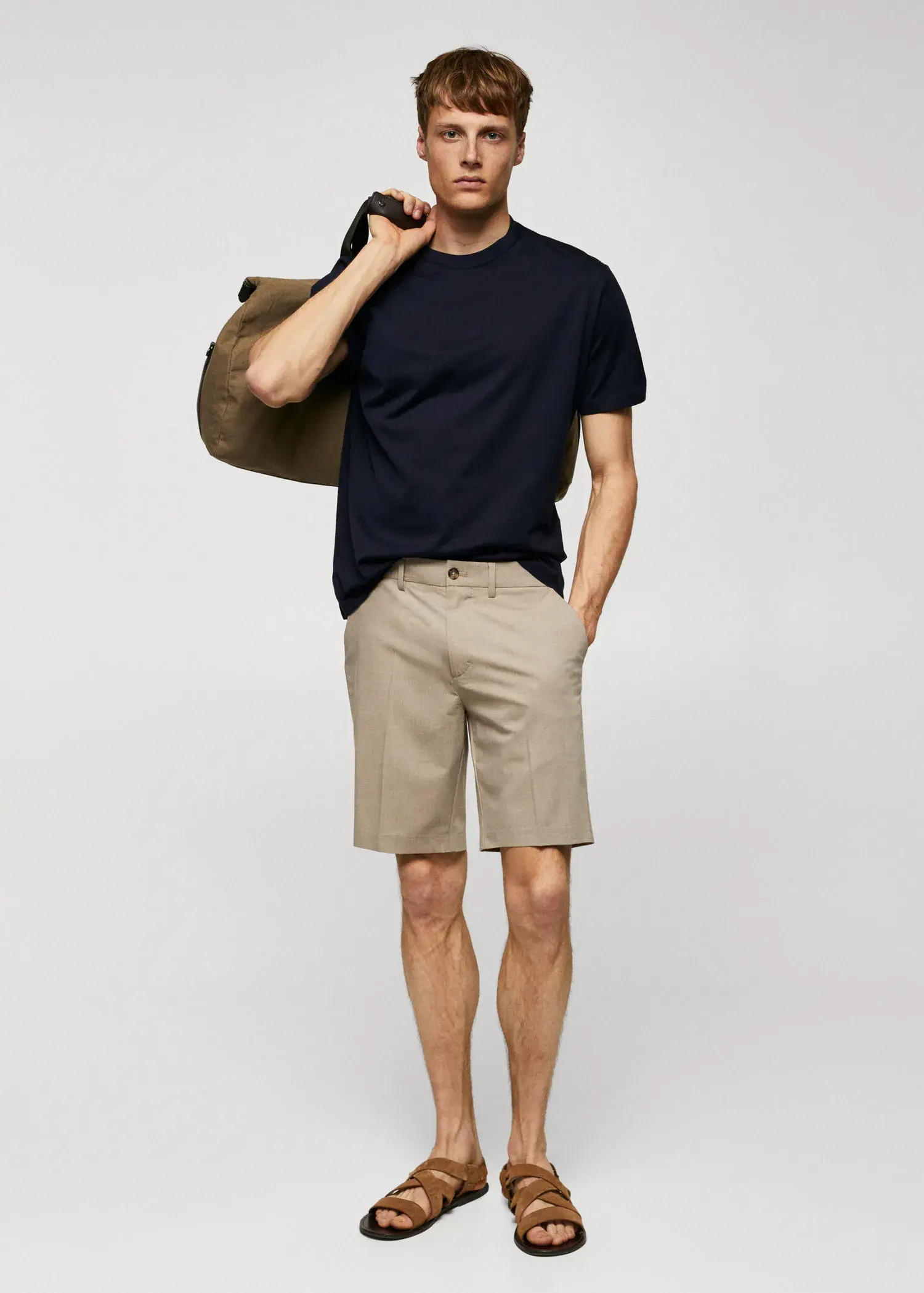 Mango Mercerized regular-fit t-shirt. a young man in shorts and a black t-shirt. 