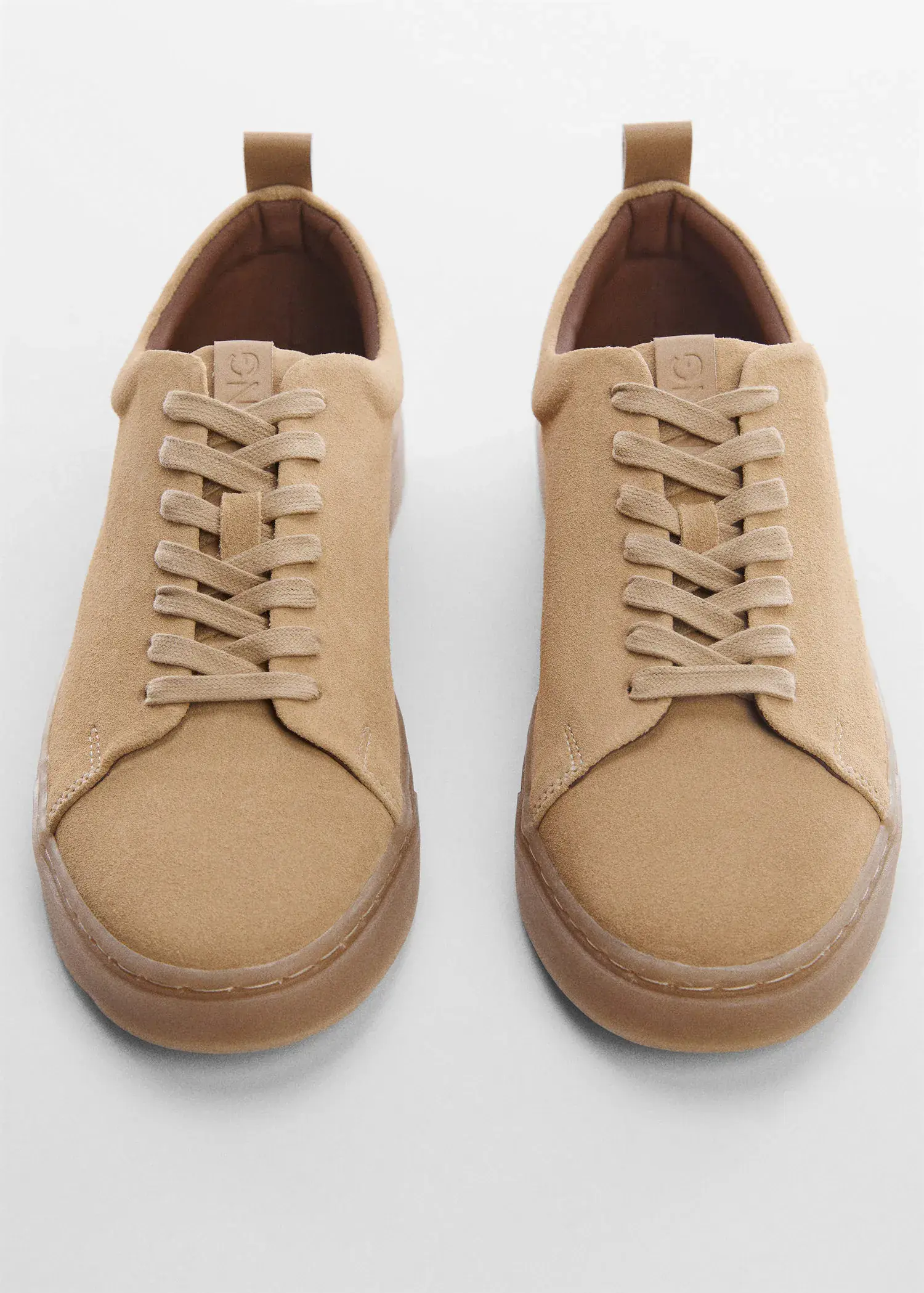 Mango Suede trainers. a close up of a pair of shoes on a table 