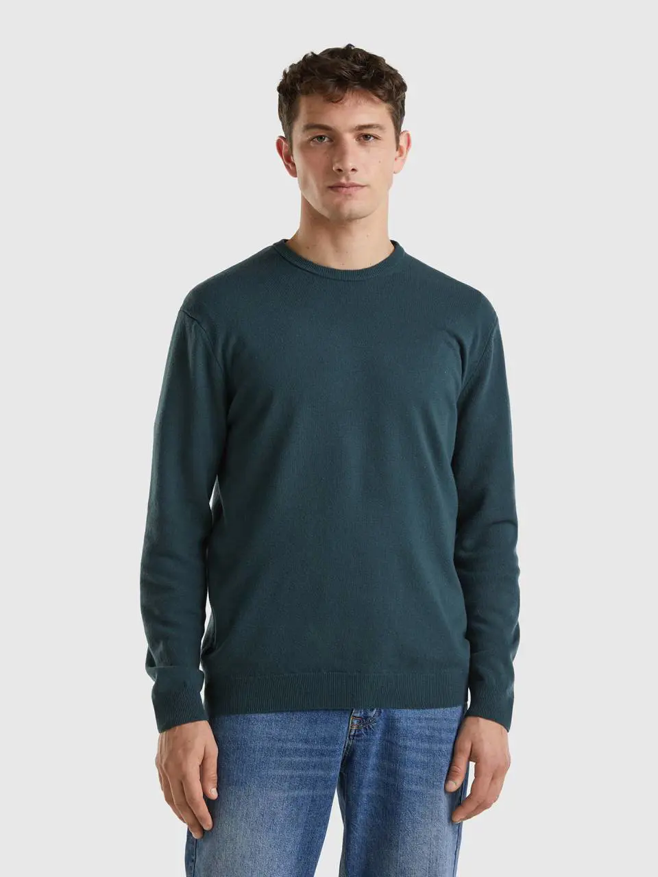 Benetton dark green crew neck sweater in pure merino wool. 1