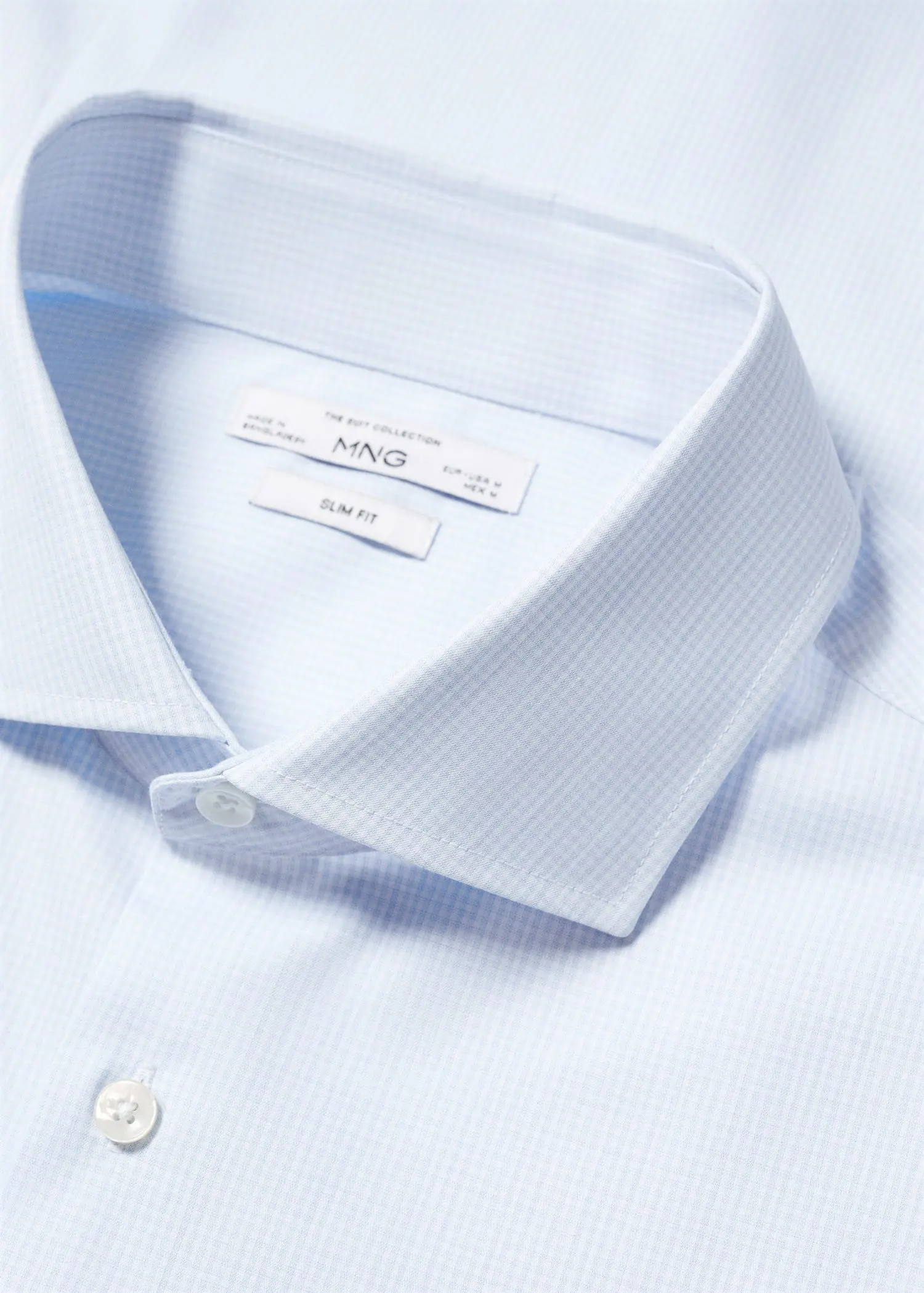 Mango Slim-fit micro-print twill suit shirt. a close-up picture of the collar of a dress shirt. 