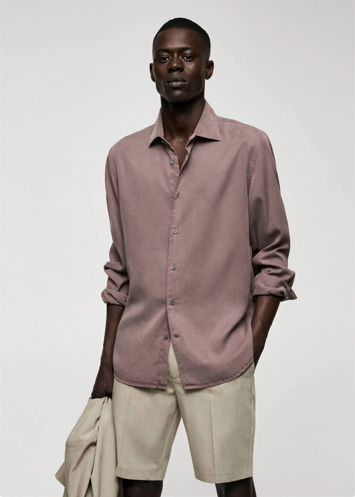Mango Lyocell fluid shirt. a man wearing a brown shirt and beige pants. 