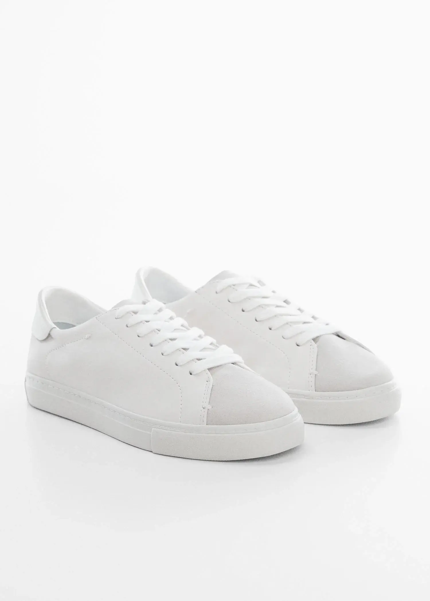 Mango Leather panel sneakers. a pair of white sneakers on a white surface. 
