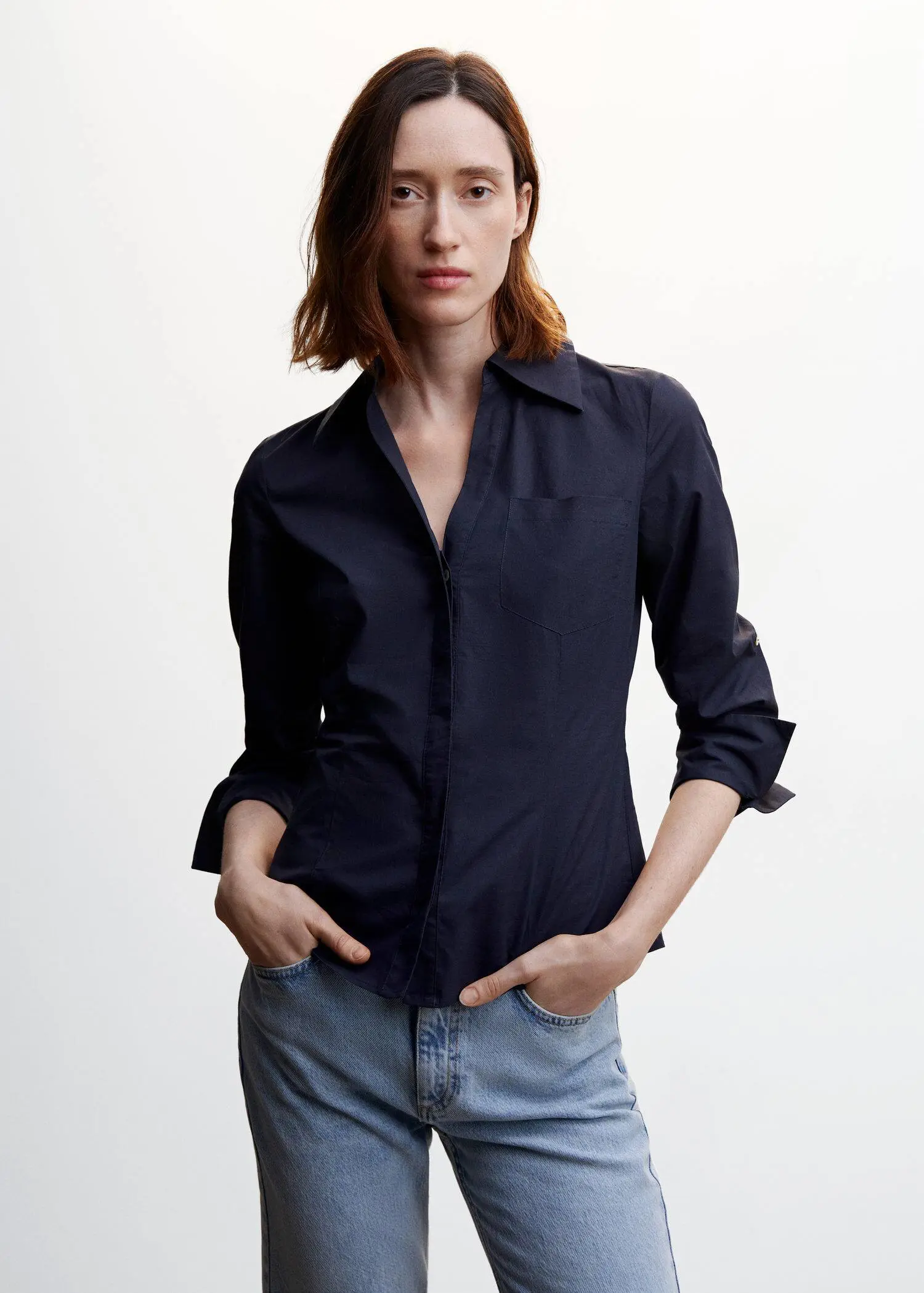 Mango Pleated cotton shirt. a woman wearing a black shirt and jeans. 