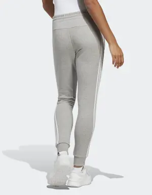 Adidas Pantalon fuselé en molleton à 3 bandes Essentials. 2 Adidas Pantalon fuselé en molleton à 3 bandes Essentials. 2