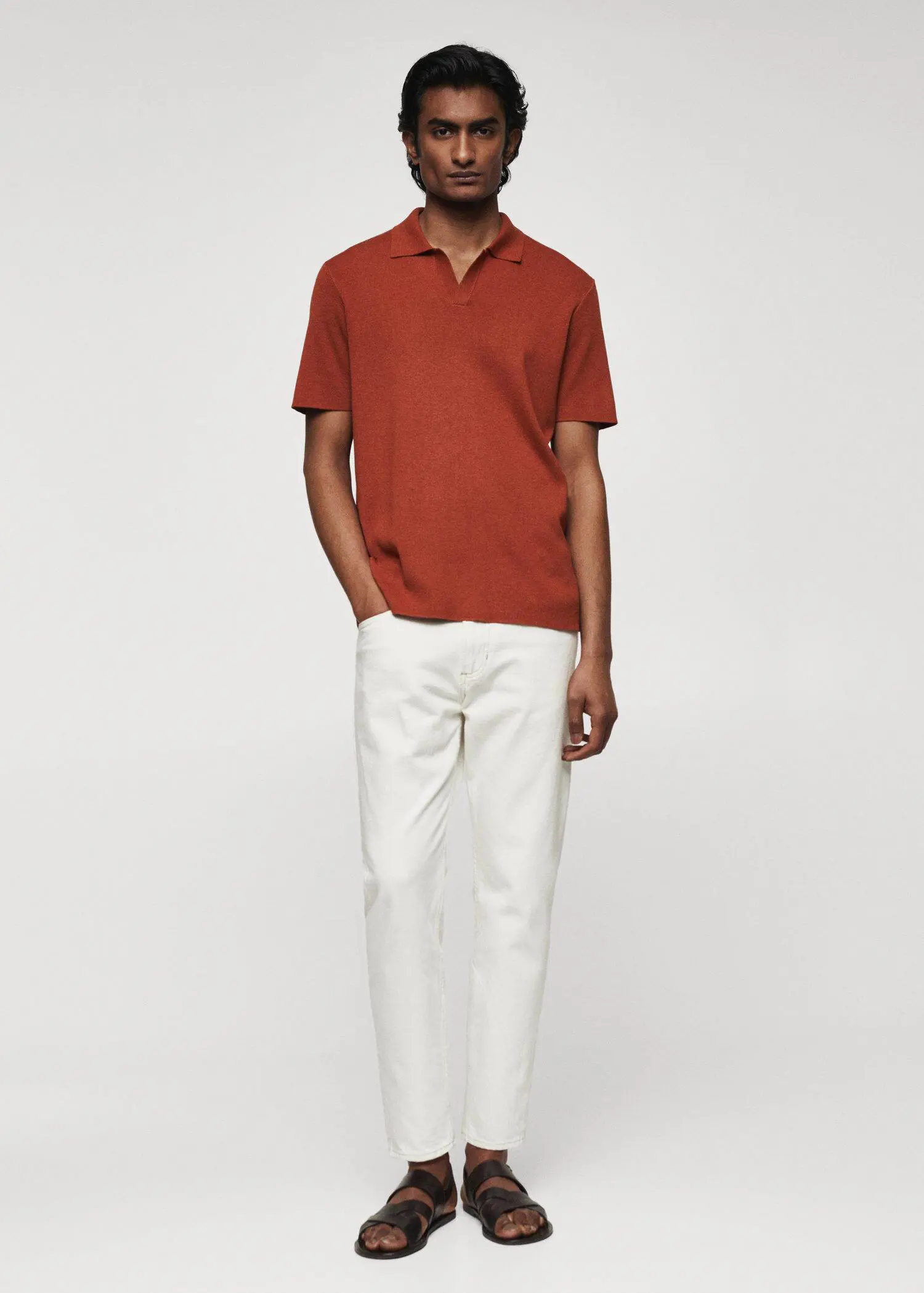 Mango Fine-knit polo shirt. a man wearing a red shirt and white pants. 