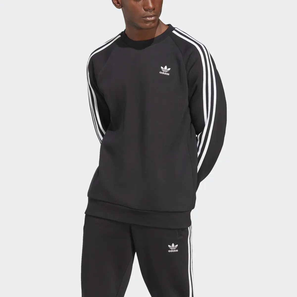 Adidas adicolor Classics 3-Streifen Sweatshirt. 1