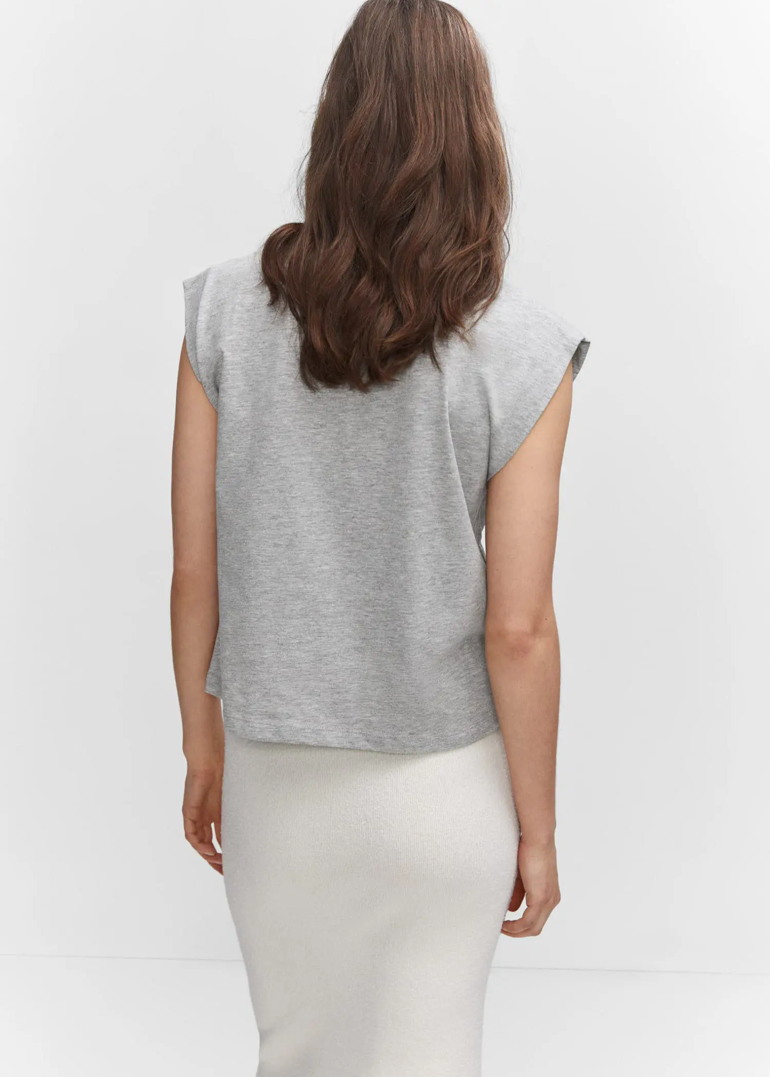 Mango Message cotton T-shirt. a woman wearing a white skirt and a gray top. 