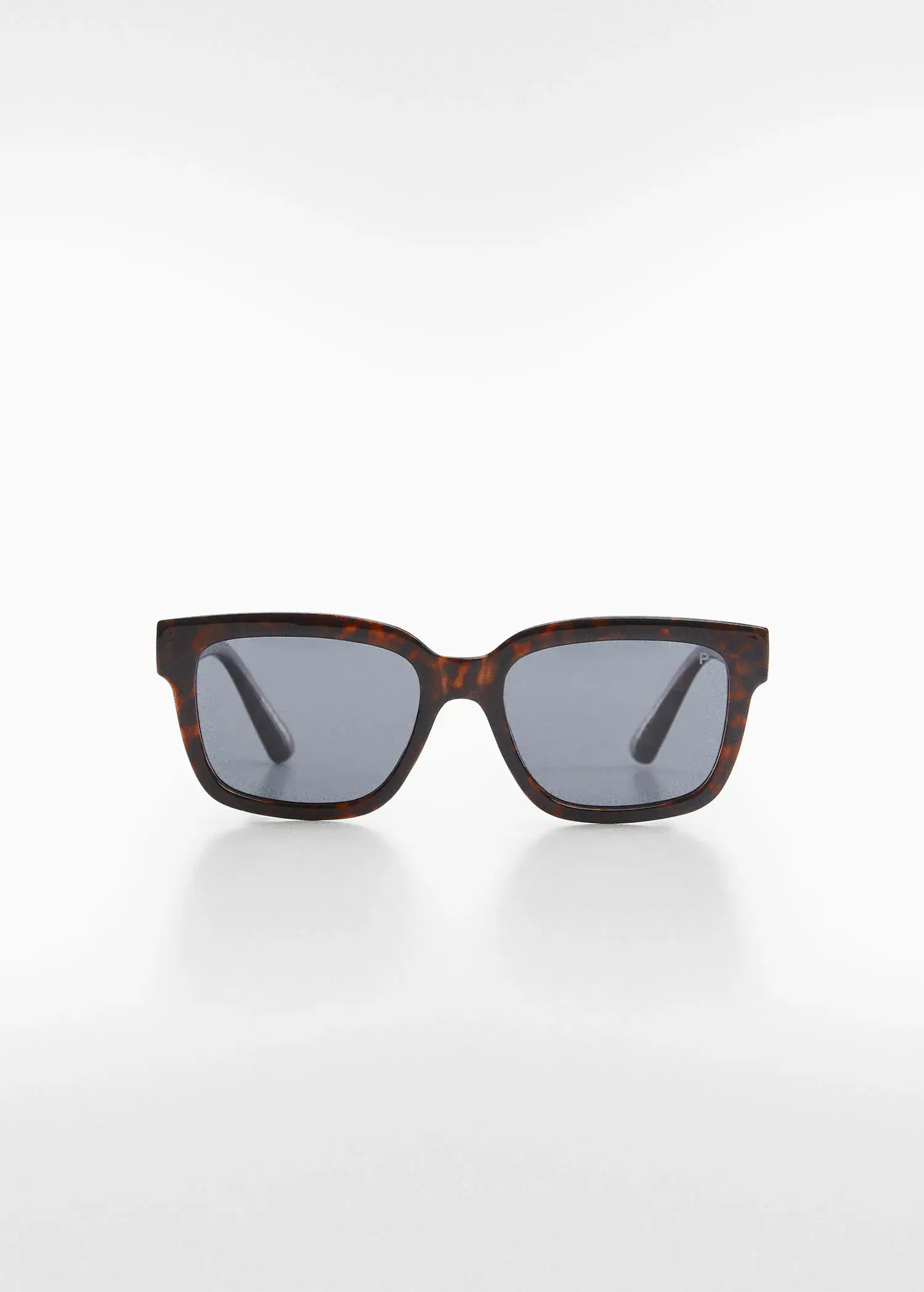 Mango Polarised sunglasses. a pair of sunglasses sitting on top of a white table. 