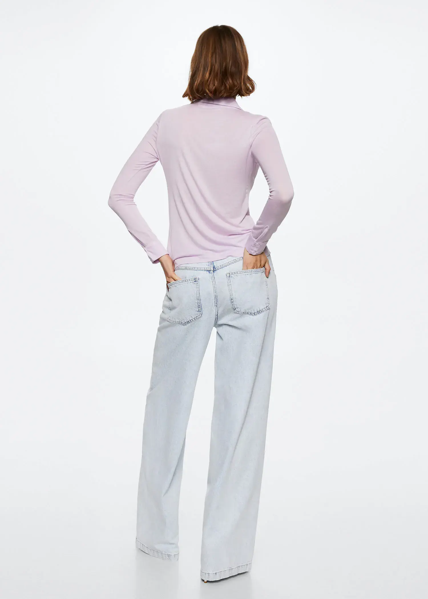 Mango Fine knit shirt. a woman standing with her hands on her hips. 