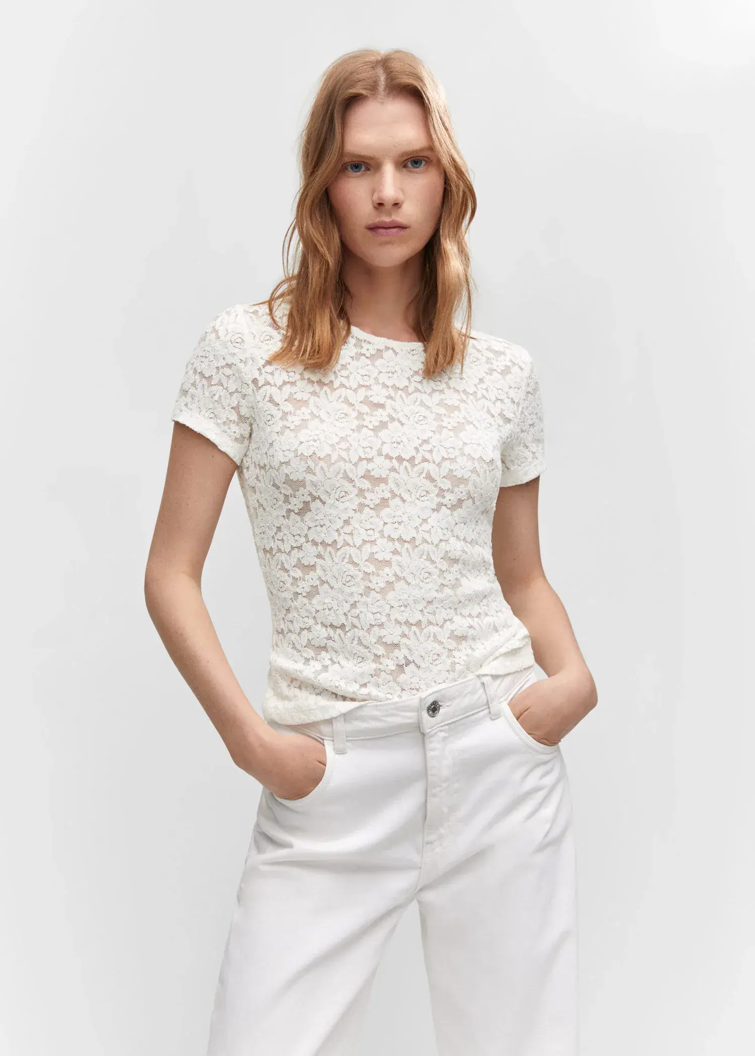 Mango Guipure T-shirt. a woman wearing white jeans and a white top. 