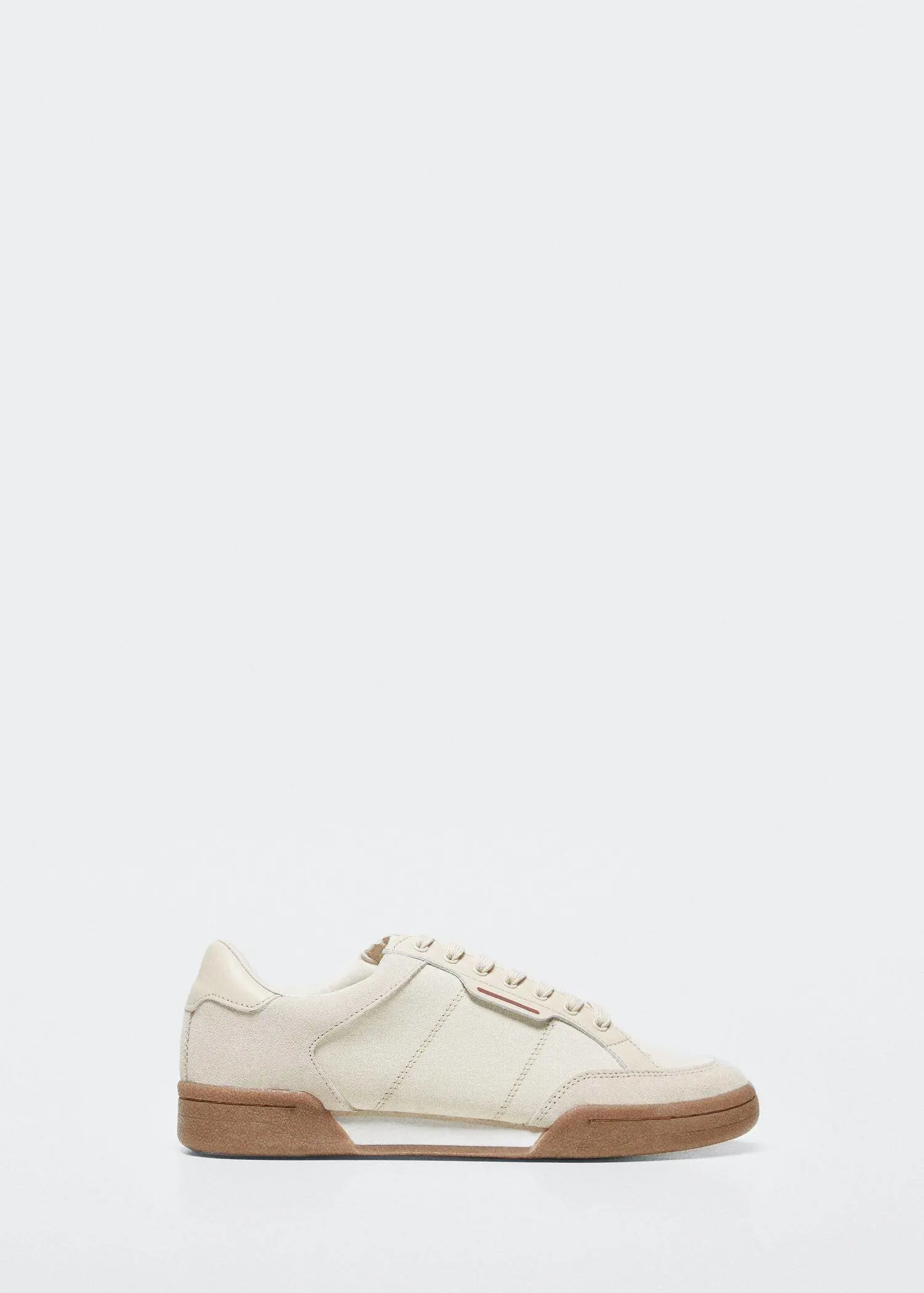 Mango Leather retro sneakers. a pair of white shoes on a white background. 