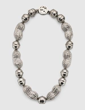 Interlocking G necklace with hazelnut and peanut charms