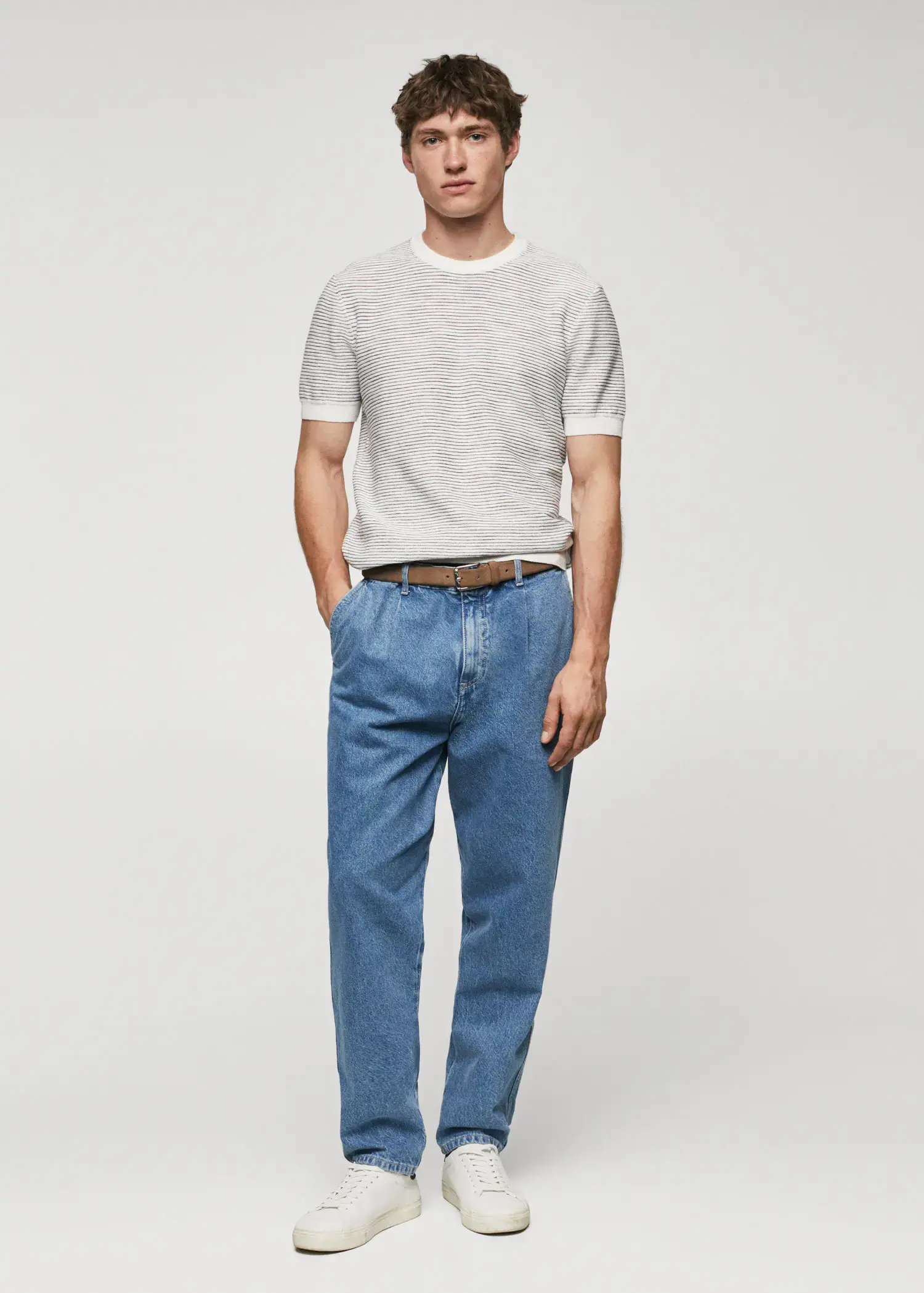 Mango Textured striped T-shirt. a man in a white shirt and blue jeans. 