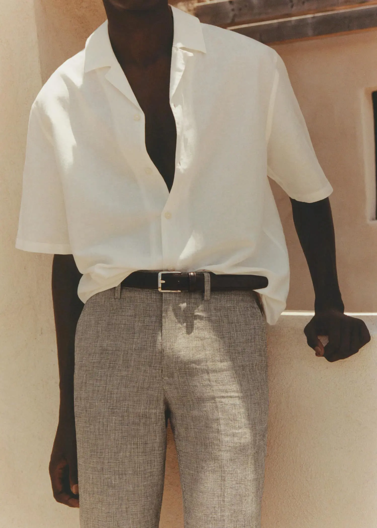 Mango Cotton-linen bowling-collar shirt. a man in a white shirt and black gloves. 