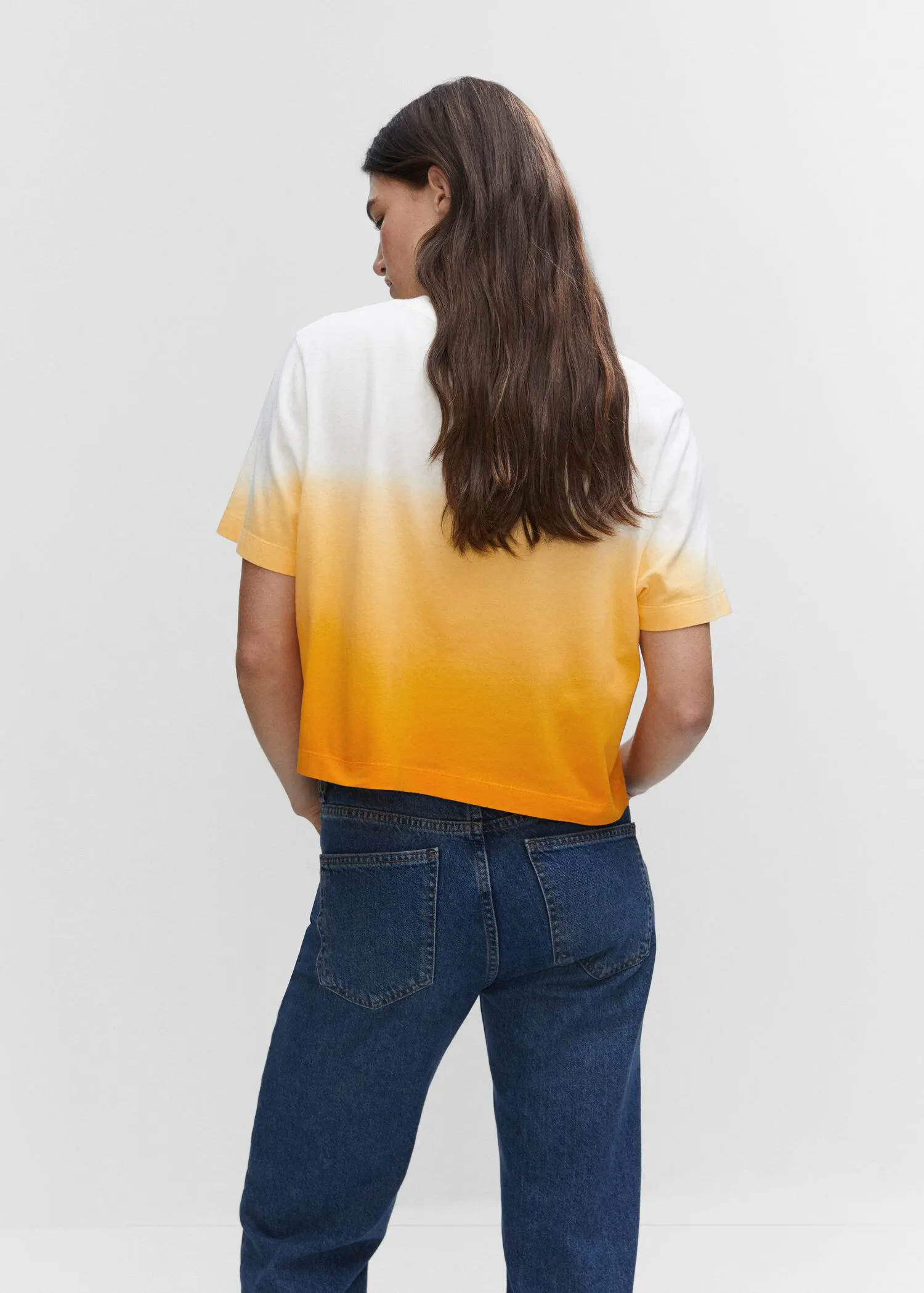 Mango Cotton ombré t-shirt. a woman is standing in front of a white wall. 